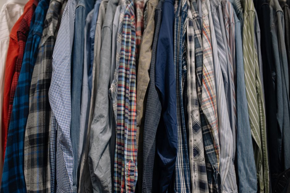 Shirts neatly hanging in a custom wardrobe
